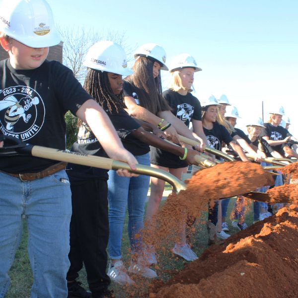  Kids with shovels engaged in groundbreaking event