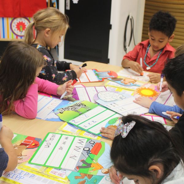  Kindergarten students working at a table