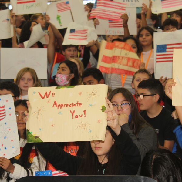  Crowd of students holding posters